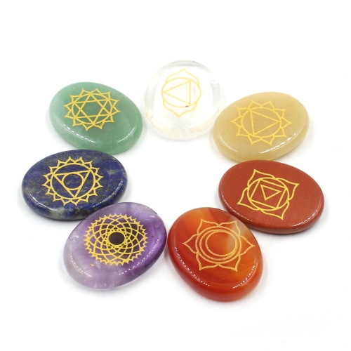 Chakra stone set - healing crystal with carved chakra symbols of oval stone chakra stone artifacts